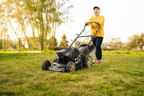 Modern lawn mower in garden